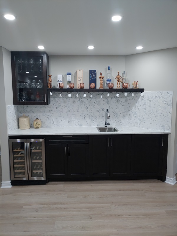 Custom basement bar with sink and fridge